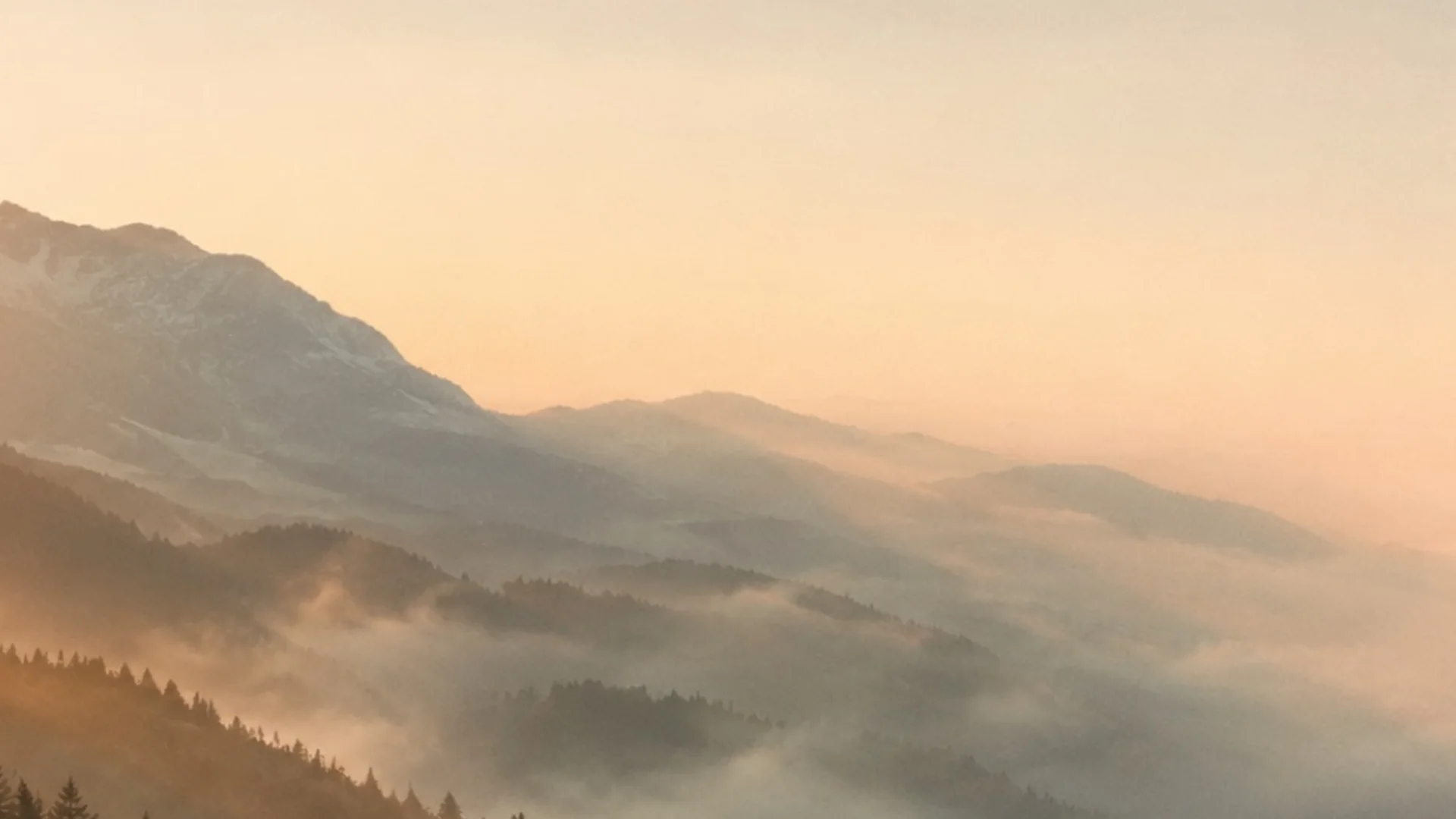 Mountains fading quietly into morning mist